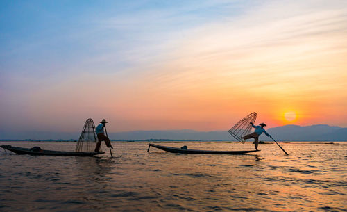 Fishing net on sea against sky