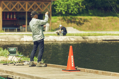 Rear view of men in lake