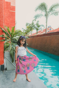 Fashion of little girl with hat in pool