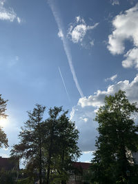 Low angle view of vapor trail against sky