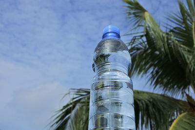 Low angle view of water bottle against sky