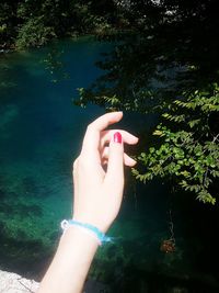 Low section of woman legs in water