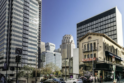 Modern buildings against sky in city