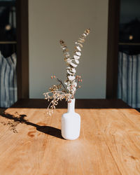 Flowers in vase on table at home