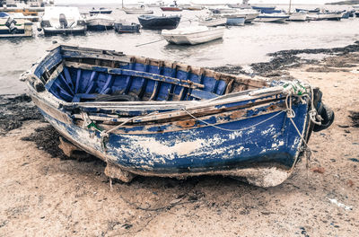 Boats moored on beach