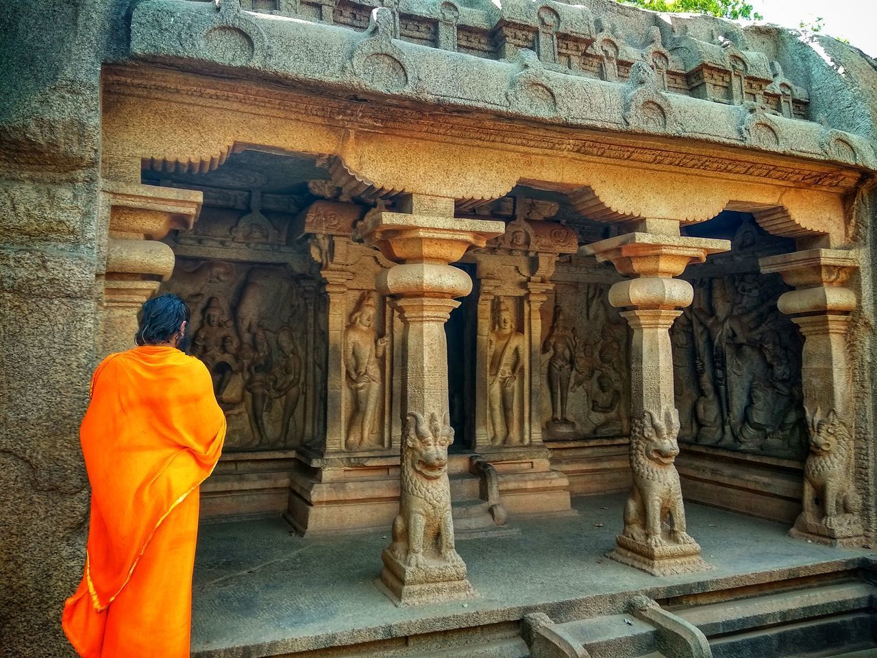 REAR VIEW OF A BUDDHA STATUE IN TEMPLE