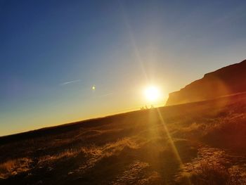 Scenic view of landscape against sky during sunset