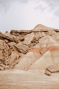 Rock formations in desert against sky