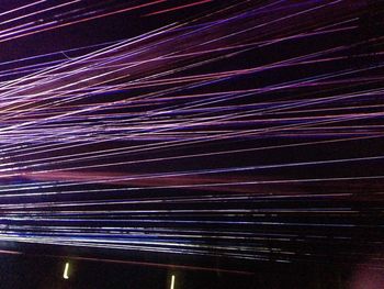 Light trails against sky at night