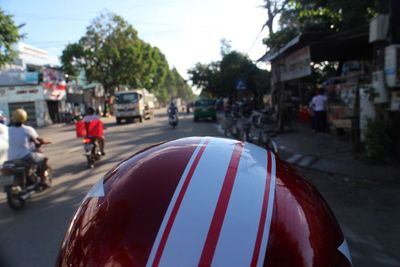 Close-up of red car on street