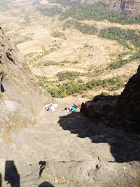 High angle view of people on rocks