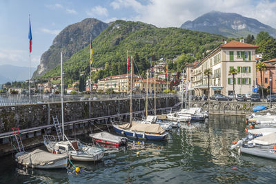 The beautiful port of menaggio with the colorful houses that are reflected on the water