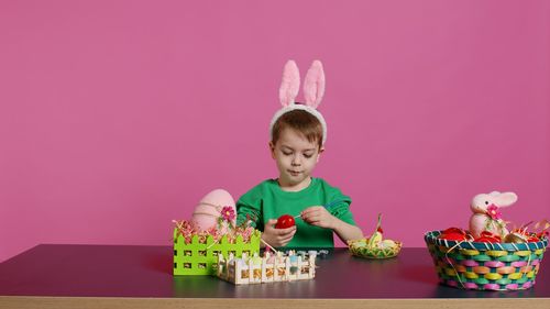 Portrait of boy playing with toys on table
