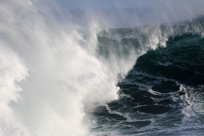 View of waves in sea against sky