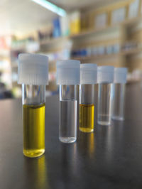 Close-up of pills in bottles on table