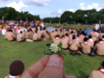 Close-up of hands holding flowers