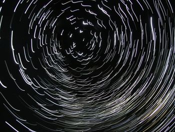 Close-up of fireworks against sky at night