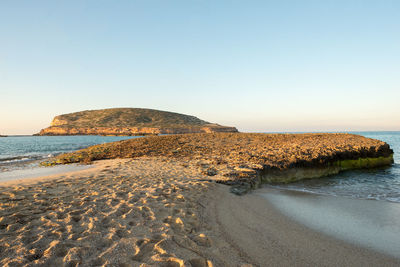 Scenic view of beach against clear sky