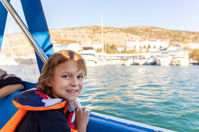 Portrait of smiling boy in boat