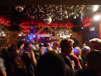 People enjoying music concert at night