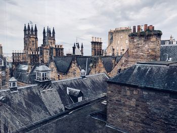 High angle view of cathedral against cloudy sky in city