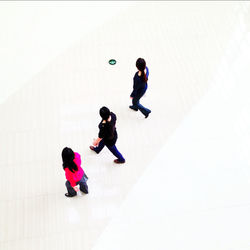 High angle view of boy playing on floor