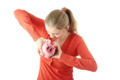 Full length of girl holding umbrella against white background