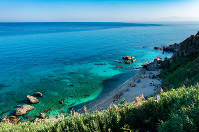 Aerial view of michelino beach in parghelia, calabria, italy. clear and transparent sea waters