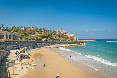 Panoramic view of beach against clear blue sky