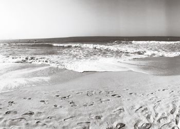 Scenic view of beach against clear sky