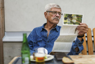 Senior man sitting outside