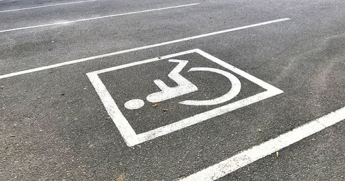 High angle view of arrow sign on road