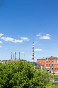 Low angle view of factory against sky