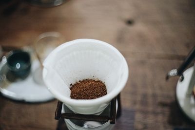 High angle view of coffee cup on table