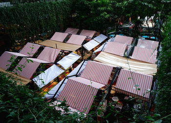 High angle view of buildings and trees on field