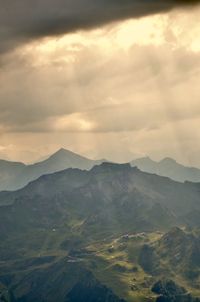Scenic view of mountains against sky during sunset