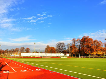 Empty running track against sky