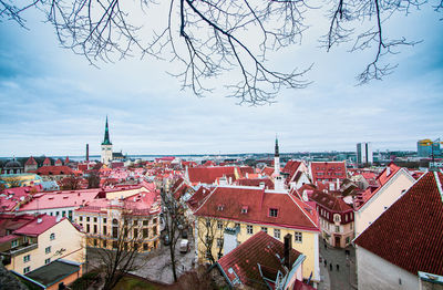 High angle view of buildings in town against sky