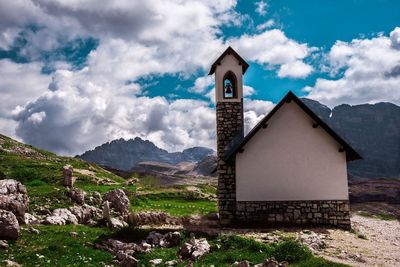 Exterior of building by mountains against sky