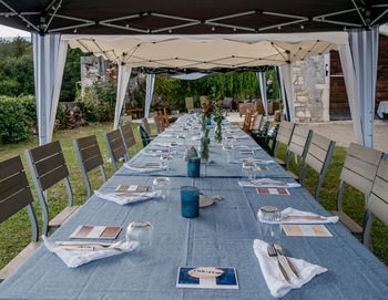 Empty chairs and tables in restaurant
