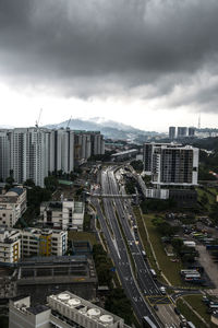 Buildings against cloudy sky