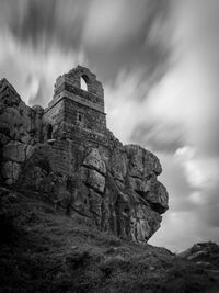 Low angle view of old ruin building against sky