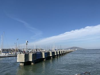 Pier over sea against sky
