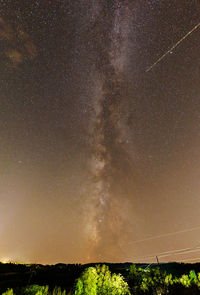 Scenic view of star field against sky at night