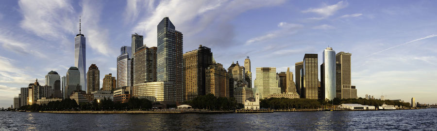 Panoramic view of river and buildings against sky