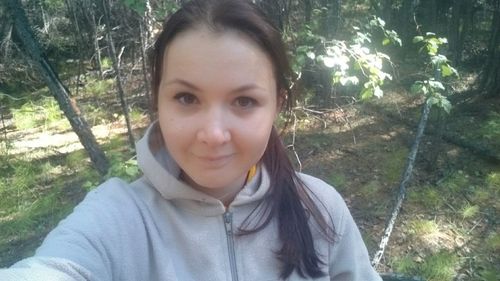 Portrait of young woman in forest