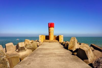 Scenic view of sea against clear blue sky