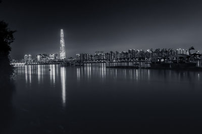 Illuminated buildings at waterfront