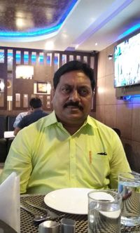 Portrait of man sitting in restaurant