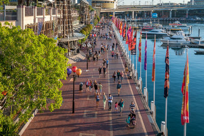 High angle view of people walking on bridge in city